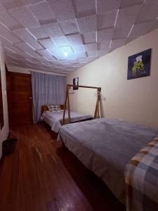 Postel nebo postele na pokoji v ubytování Aquisito Nomas Es + 8 fotografií