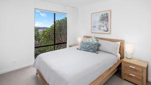 Postel nebo postele na pokoji v ubytování By The Bay