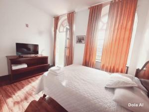 Ένα ή περισσότερα κρεβάτια σε δωμάτιο στο Estancia Grer By Chat Noir +23 φωτογραφίες