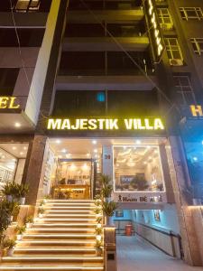 a mall with stairs in front of a building at Majestik Hanoi Hotel in Hanoi