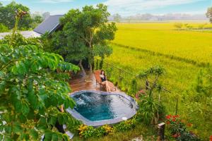 an overhead view of a hot tub in a field at An House in Sóc Sơn