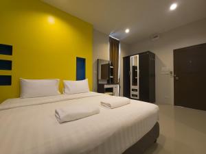 Ένα ή περισσότερα κρεβάτια σε δωμάτιο στο Nirvana@Phala +7 φωτογραφίες