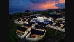 an aerial view of a building with black roofs at Amayi Resort Nusa Dua in Nusa Dua