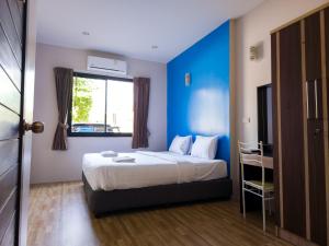 Ένα ή περισσότερα κρεβάτια σε δωμάτιο στο Nirvana@Phala