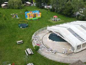 an aerial view of a park with a playground at Mobil-home avec terrasse à Luynes - API-1-52-1072 in Luynes