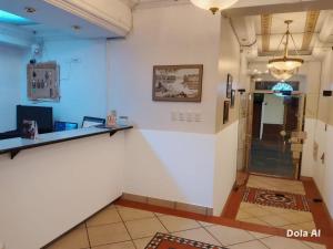 Ο χώρος του λόμπι ή της ρεσεψιόν στο Estancia Grer By Chat Noir