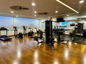 a gym with treadmills and exercise equipment in a room at Luxury Condo en Nuevo Vallarta Alberca Tipo Resort in Nuevo Vallarta