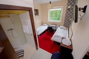 Postel nebo postele na pokoji v ubytování Hotelik Jankowski