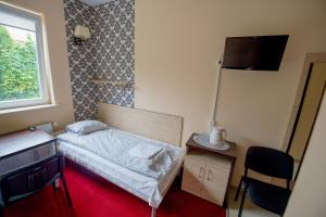 Postel nebo postele na pokoji v ubytování Hotelik Jankowski