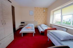 Postel nebo postele na pokoji v ubytování Hotelik Jankowski