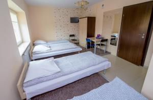 Postel nebo postele na pokoji v ubytování Hotelik Jankowski