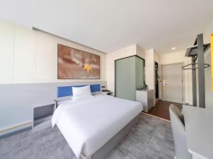 Una cocina o cocineta en 7 Days Inn Tai'an Dongpingxi Hualian