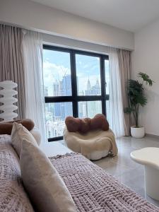 Ένα ή περισσότερα κρεβάτια σε δωμάτιο στο Agile Residence Bukit Bintang by Skyline Homes