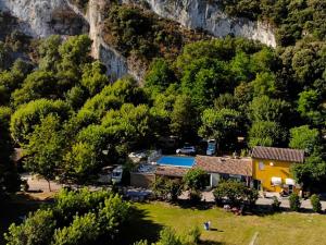 a house in the middle of a mountain at Gîte confortable avec terrasse à Salavas - API-1-52-1143 in Vallon-Pont-dʼArc