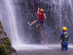 a person on a rope jumping off of a waterfall at Gîte confortable avec terrasse à Salavas - API-1-52-1143 in Vallon-Pont-dʼArc