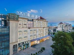 an aerial view of the olympic building at Xana Hotelle Luzhou High-Speed Railway Station Trading Market Passenger Terminal in Luzhou