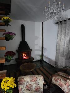 Et opholdsområde på Suítes Sonhos e Requinte