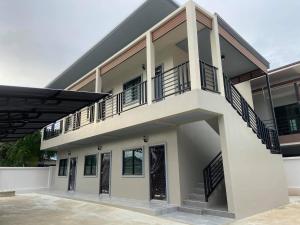 a building with balconies on the side of it at ZAMZAM House in Thalang