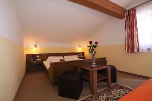 Ένα ή περισσότερα κρεβάτια σε δωμάτιο στο Ausfernerhof