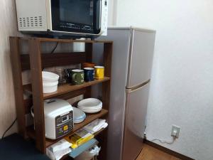 Kuchyň nebo kuchyňský kout v ubytování プレストン筒井