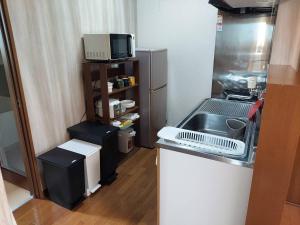 Kuchyň nebo kuchyňský kout v ubytování プレストン筒井