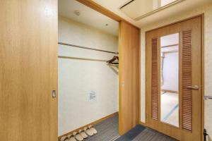 a hallway with a door and a window at Hotel KOYO Bekkan - Vacation STAY 37061v in Hashima +1 photo