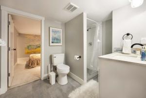 a bathroom with a toilet and a shower and a sink at Renton DT 1BR Suite WS 95 Near Landing &Sea-Tac in Renton