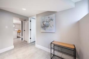 a living room with a vase of flowers on the wall at Renton DT 1BR Suite WS 95 Near Landing &Sea-Tac in Renton