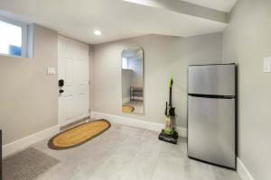 a kitchen with a refrigerator and a mirror at Renton DT 1BR Suite WS 95 Near Landing &Sea-Tac in Renton +25 photos