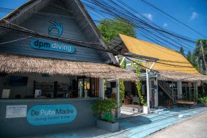 a store with a sign on the front of it at DPM Koh Tao Diving Hotel & Bar in Koh Tao
