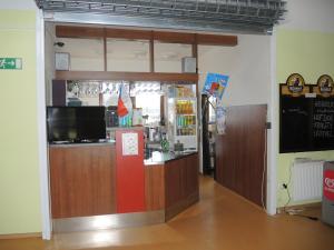 a store entrance with a counter in a room at Sportovní areál Horní Počaply in Horní Počaply