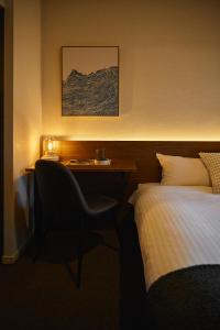 Ένα ή περισσότερα κρεβάτια σε δωμάτιο στο Residence Hotel Hakata 3