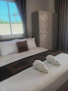 Ένα ή περισσότερα κρεβάτια σε δωμάτιο στο BaanPhong Lanta