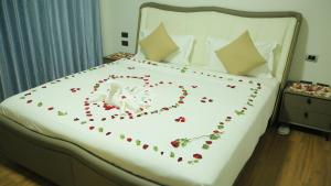 Ένα ή περισσότερα κρεβάτια σε δωμάτιο στο Romanat Addis Hotel +3 φωτογραφίες