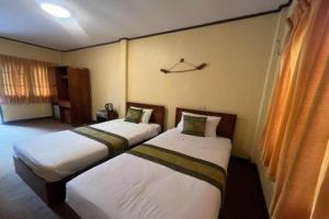 Giường trong phòng chung tại Pai Hill Side Resort