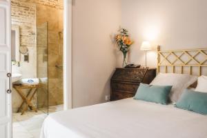 Un ou plusieurs lits dans un hébergement de l'établissement Hotel Boutique Casa de Colón