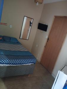 Ένα ή περισσότερα κρεβάτια σε δωμάτιο στο Pousada Descanse & Curta