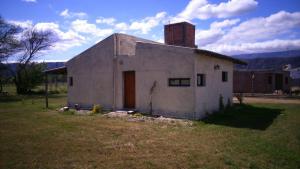 a small white building with a chimney on top of it at CABAÑAS LDM in San Isidro