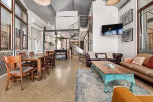 a living room with a table and chairs at Hidden Zen - A South Freo Retreat in South Fremantle