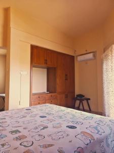 Ένα ή περισσότερα κρεβάτια σε δωμάτιο στο Kandiana 6A