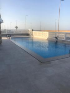 a swimming pool with blue water on a building at Rock House in Marsa Alam City +73 photos