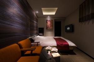 Een bed of bedden in een kamer bij The CALM Hotel Tokyo