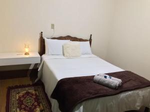 Ένα ή περισσότερα κρεβάτια σε δωμάτιο στο Hostel da Dri