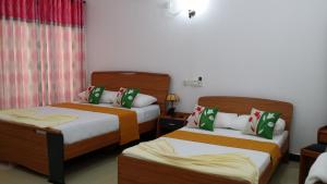 Letto o letti in una camera di Sigiri Regal Residence