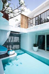 a house with a swimming pool with a house at Villa Windingland in Hengchun