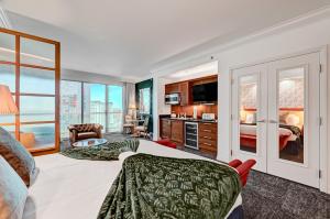 a hotel room with a bed and a living room at Vintage Lair STUDIO Balcony F1 SPHERE VIEW Tower 3 in Las Vegas +31 photos