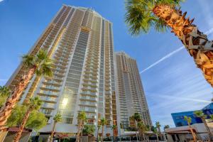 a tall building with palm trees in front of it at Vintage Lair STUDIO Balcony F1 SPHERE VIEW Tower 3 in Las Vegas