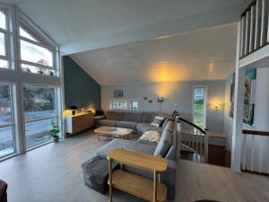 a living room with a couch and a table at 10 person holiday home in Stathelle-By Traum in Stathelle
