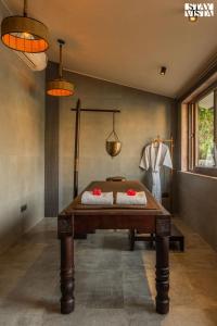 a ping pong table in a room at StayVista at The Birdwood Estate with Gym and Pool in New Delhi