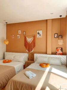 a bedroom with two beds with towels on them at Gin House Đà Lạt in Da Lat +29 photos